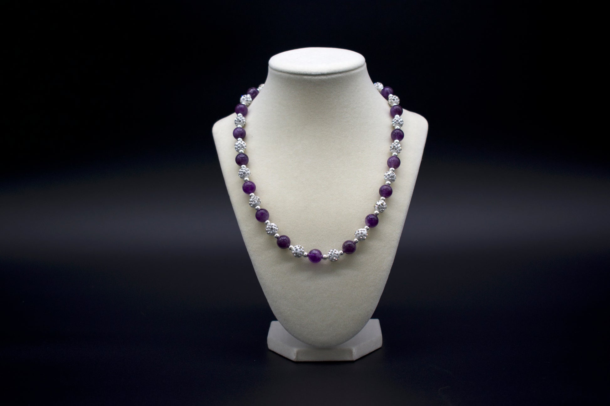 Custom beaded amethyst necklace from Ancient Wellness, handcrafted with genuine amethyst crystals, symbolizing tranquility, spiritual growth, and healing, suitable for both men and women.