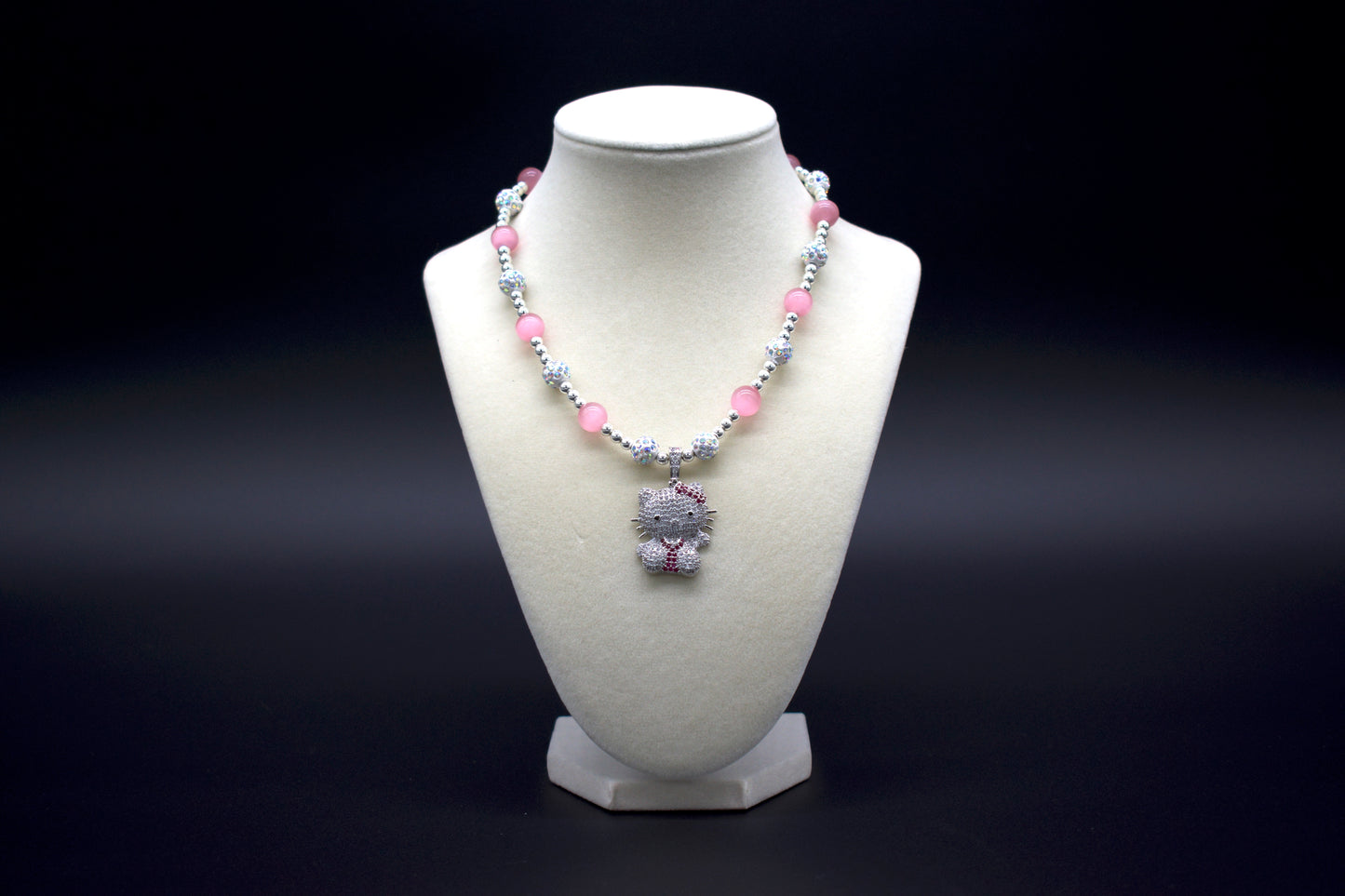 Custom beaded pink cat’s eye necklace from Ancient Wellness, featuring a Hello Kitty pendant, handcrafted with genuine pink cat’s eye crystals, symbolizing love, protection, and intuition, suitable for both women and girls.