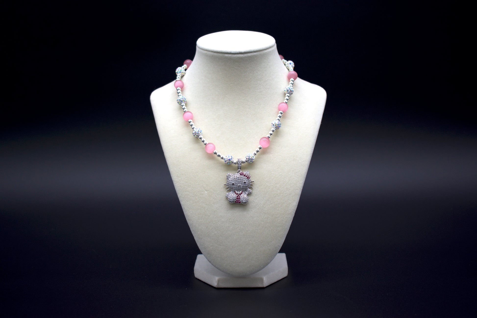 Custom beaded pink cat’s eye necklace from Ancient Wellness, featuring a Hello Kitty pendant, handcrafted with genuine pink cat’s eye crystals, symbolizing love, protection, and intuition, suitable for both women and girls.