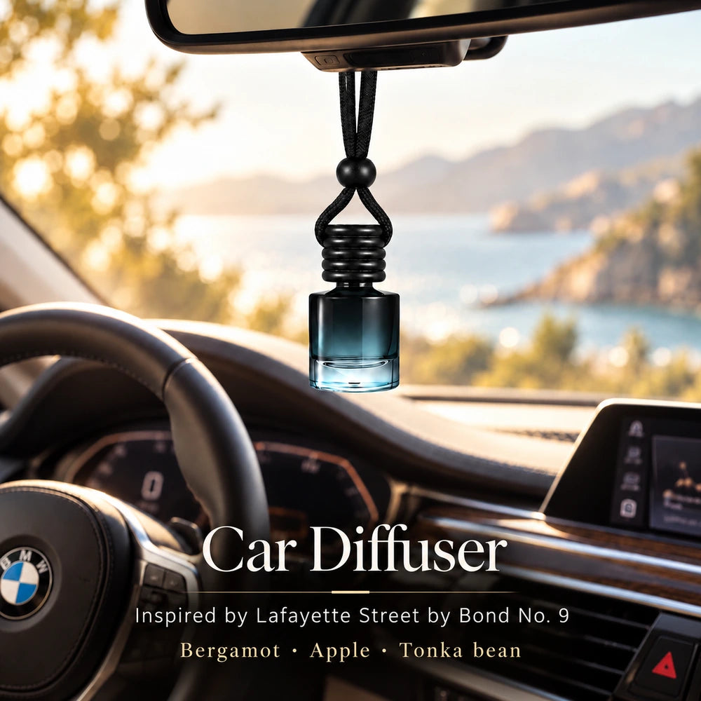 Ancient Wellness Lafayette Street car diffuser hanging from a rearview mirror in a BMW interior