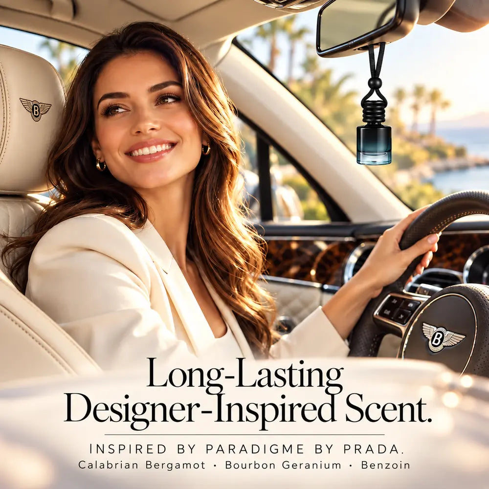 Paradigme Inspired by Prada car diffuser hanging in a luxury car beside a smiling woman with Calabrian bergamot, Bourbon geranium and benzoin notes